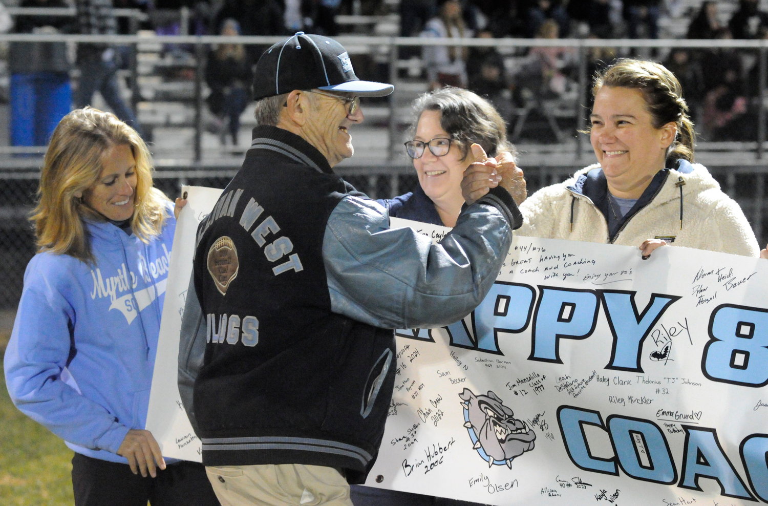 Happy birthday, Coach Bauer. During halftime, coach Ron Bauer was presented with a banner honoring his 80th birthday (which took place on October 18). The banner was signed by hundreds of fans, including players, students (both current and former) and parents.